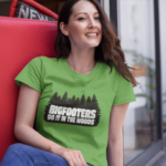 Woman wearing a Bigfooters do it in the woods tshirt